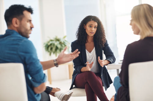 Shot of a couple having an argument during a counseling session with a therapist - KM Family Law