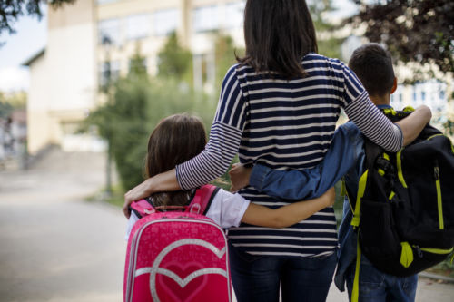Mother taking kids to school - KM Family Law